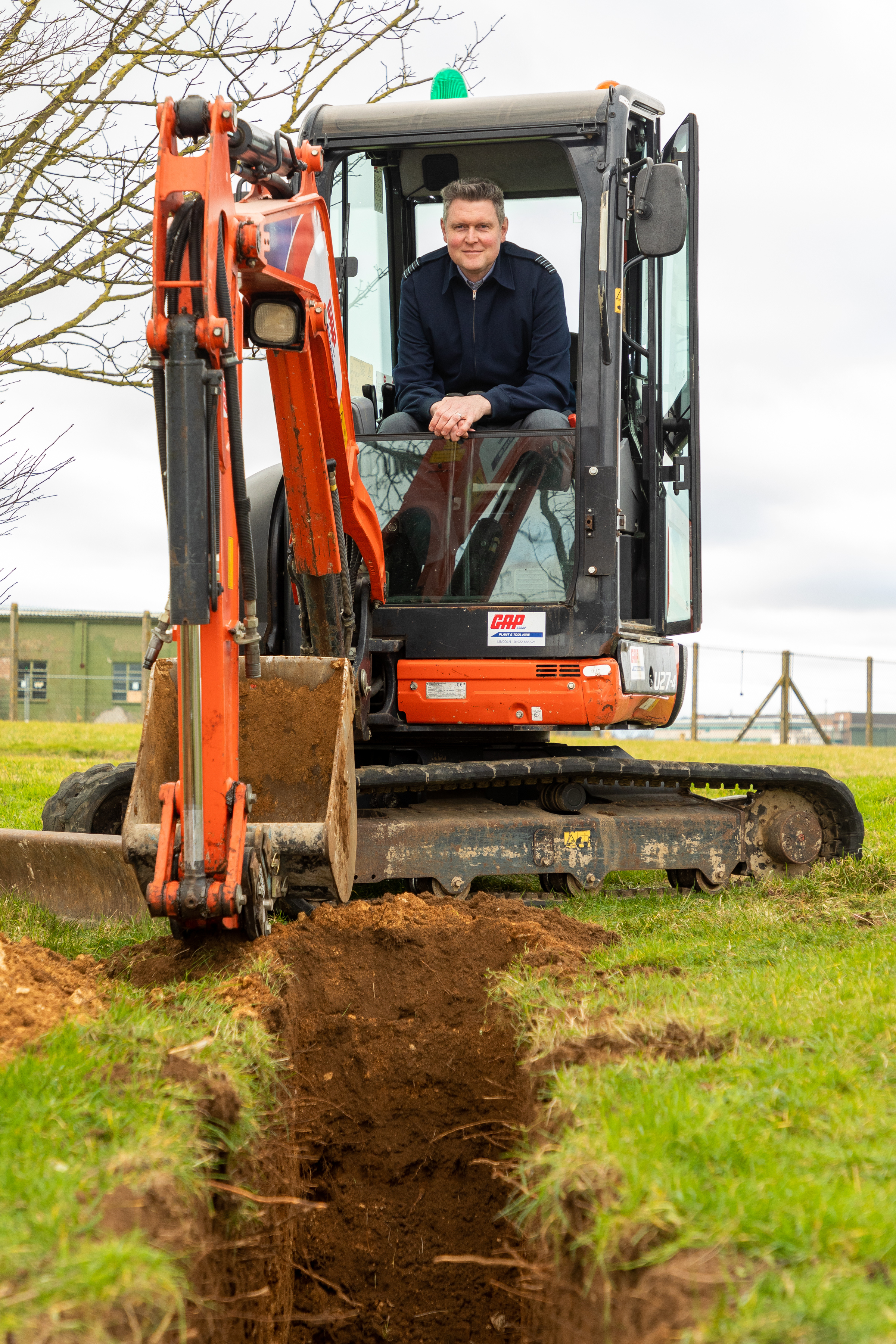 Personnel inside digger.